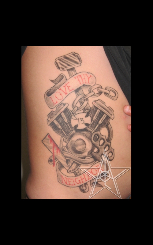 Traditional style engine tattoo on the upper arm